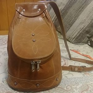 14 x 10 base. Leather bucket/sling bag.